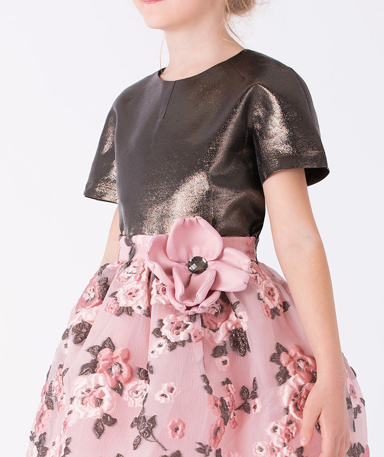 a metallic-textured bodice and a flowing floral skirt