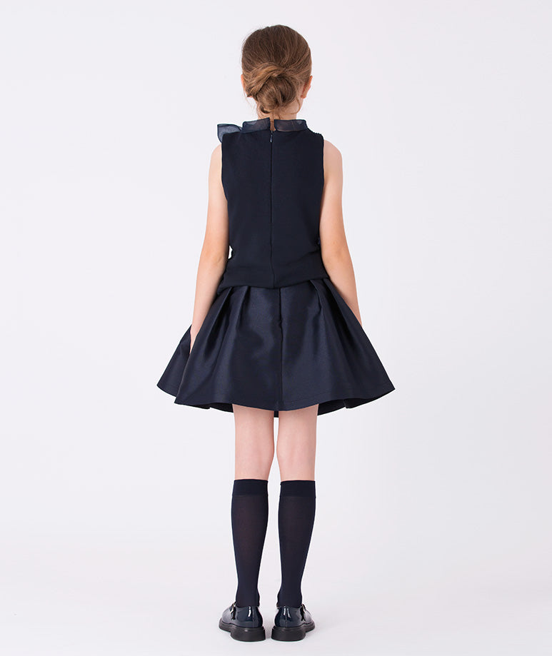 A sleeveless navy glitter blouse