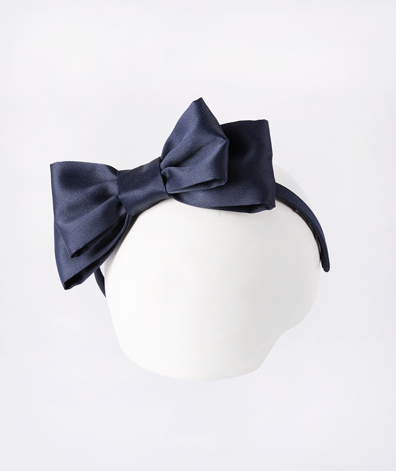 Classic navy headband for a timeless, effortless finish.