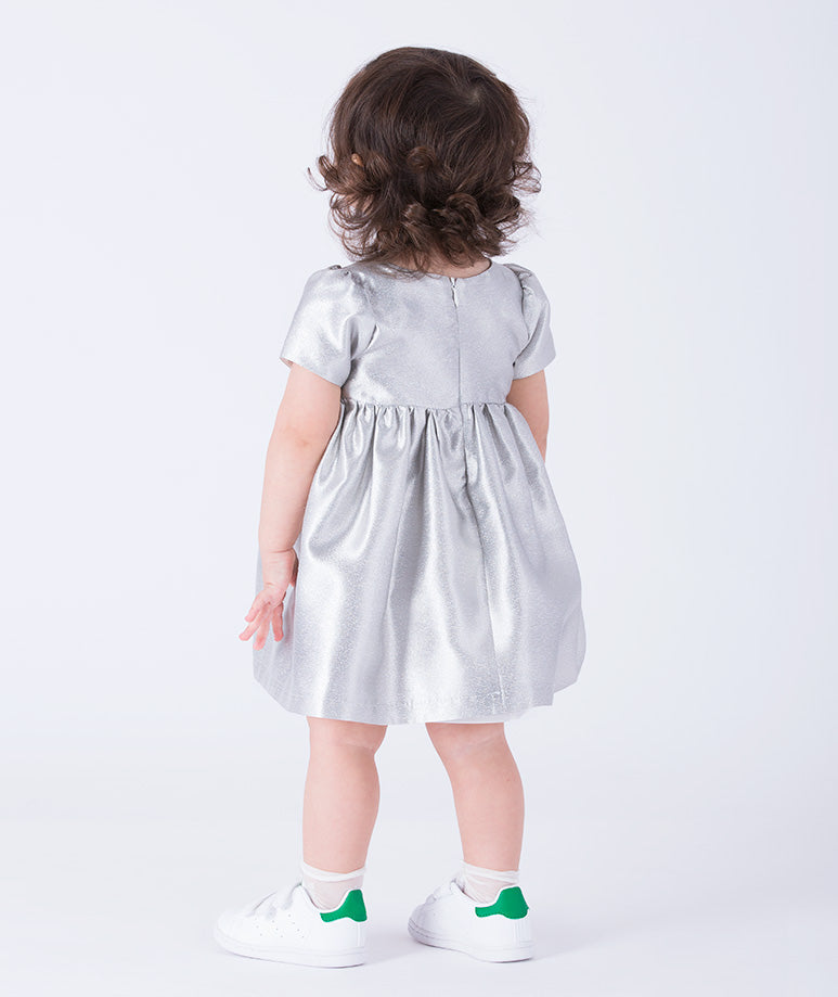 An elegant silver baby dress