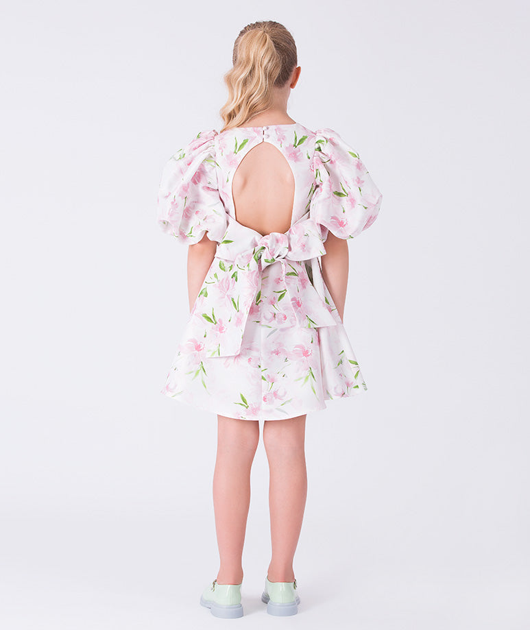 Back view of a balloon sleeve floral girls dress featuring an open-back bow detail, ideal for weddings, parties, and special occasions for ages 3–12.