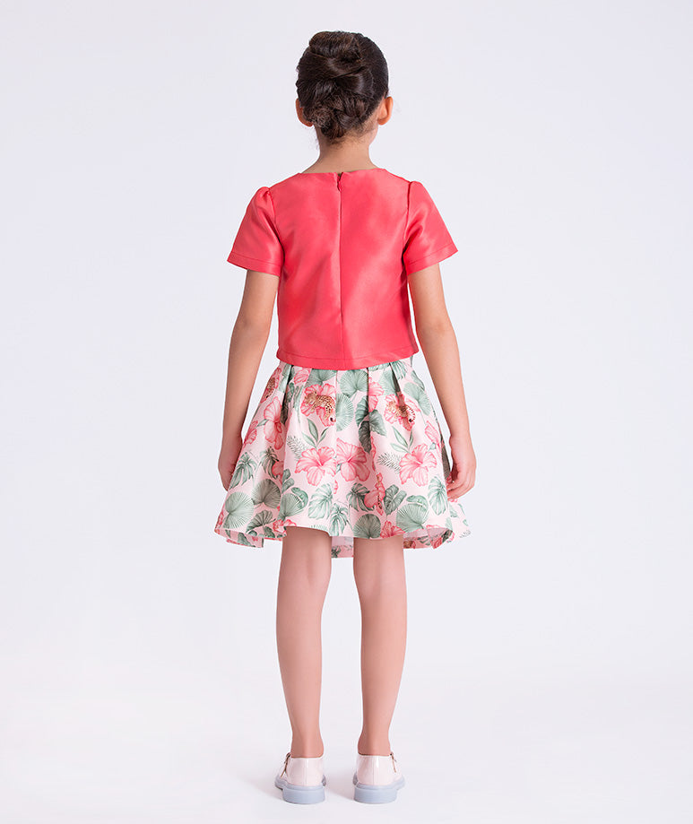 Back view of the Bow Enchanted Girls Outfit showing the tailored top and softly flared floral skirt made from breathable lightweight fabric, designed for girls ages 3–12 for Eid, Easter, and garden parties.
