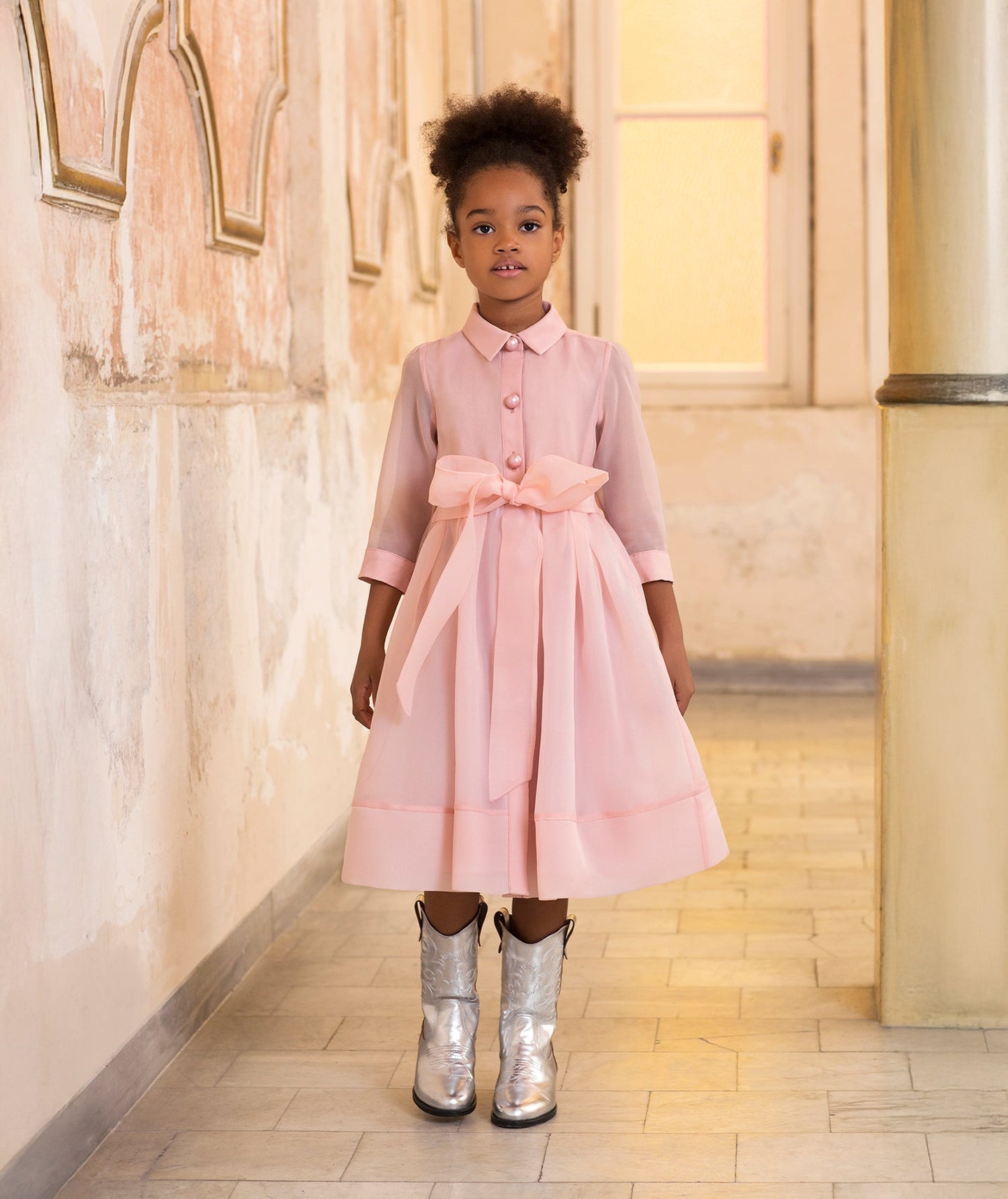 long pink dress with pearl buttons and a bow on the waist for kids