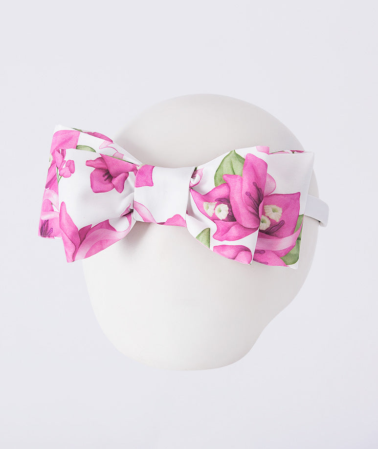 Classic floral bow headband with soft printed fabric, designed to complement girls’ outfits with a timeless and elegant finish.