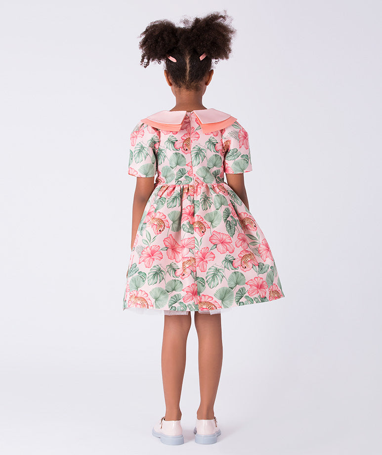 Back view of the Mahe Lotus Floral Girls Dress showing the refined collar detail, tailored bodice, and softly flared skirt crafted from breathable lightweight fabric, designed for girls ages 3–12 for Eid celebrations, garden parties, and spring–summer occasions.