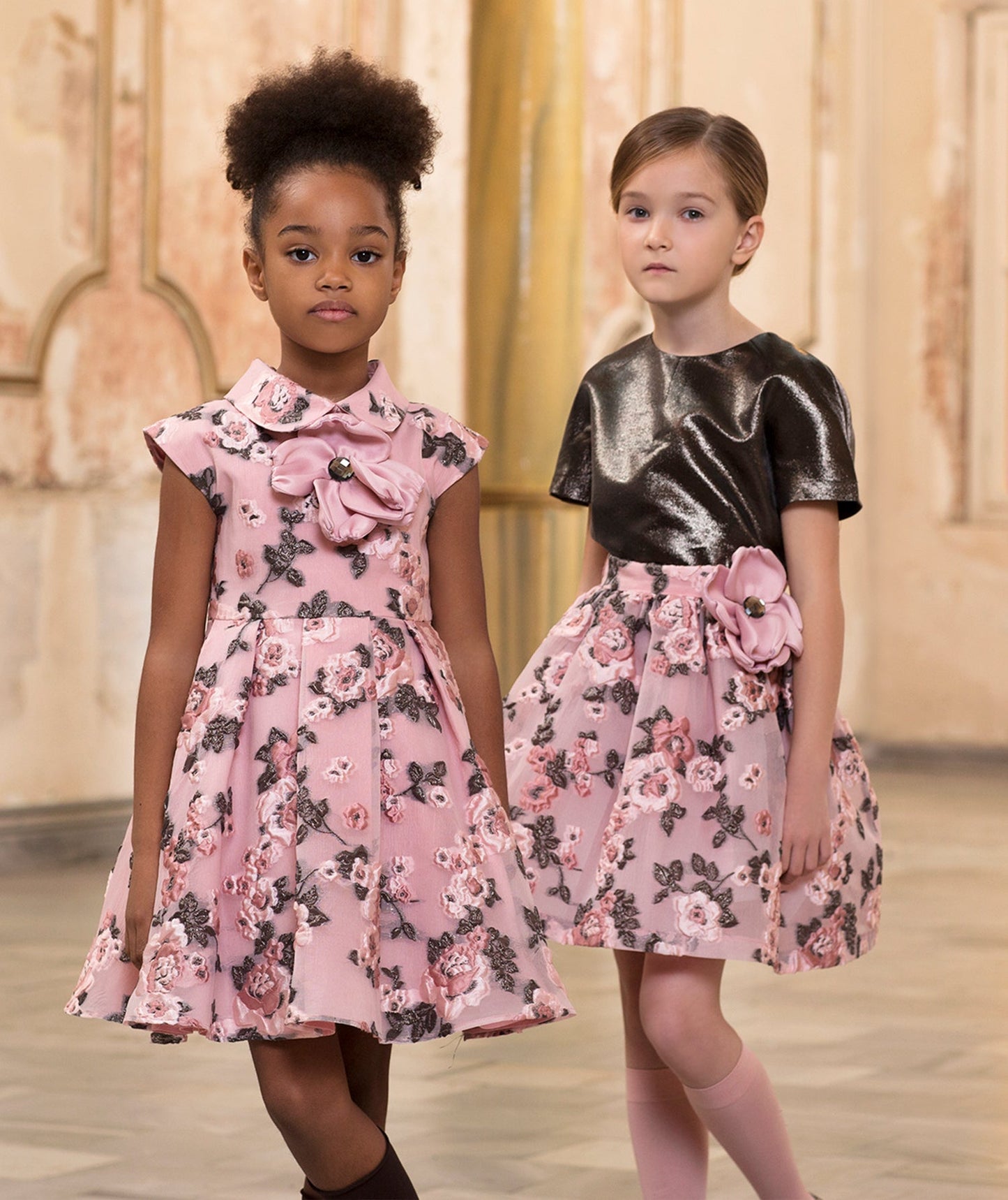 pink dress with a 3D flower detail and brown flower embroidery, metallic bronze blouse and pink floral embroidered skirt with a 3D flower on the waist