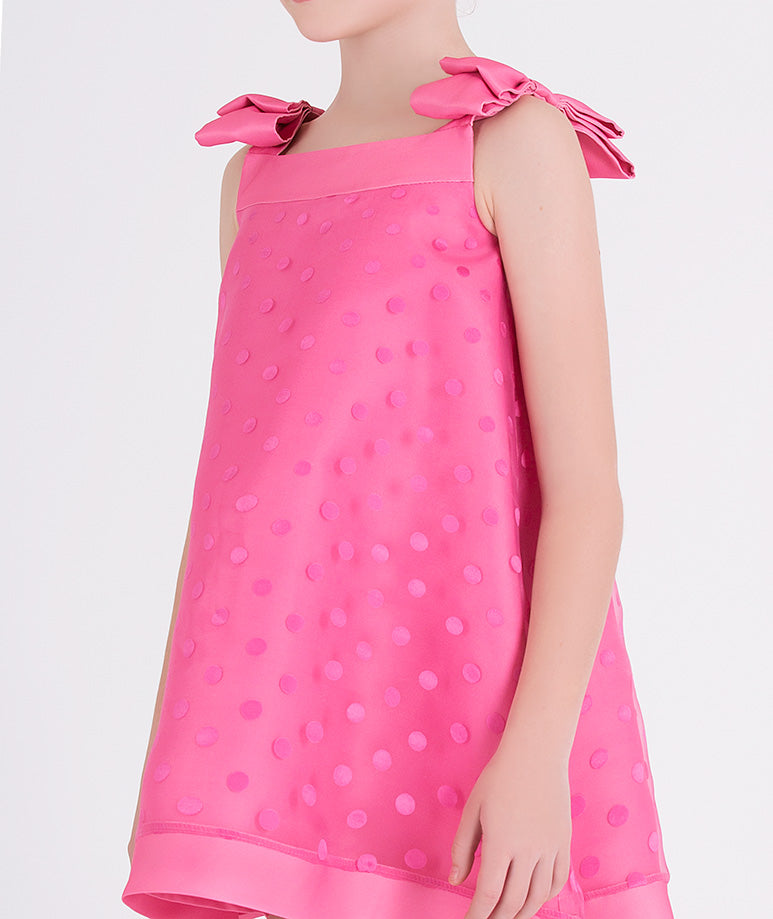 pink polka dot dress with bows on the shoulders 