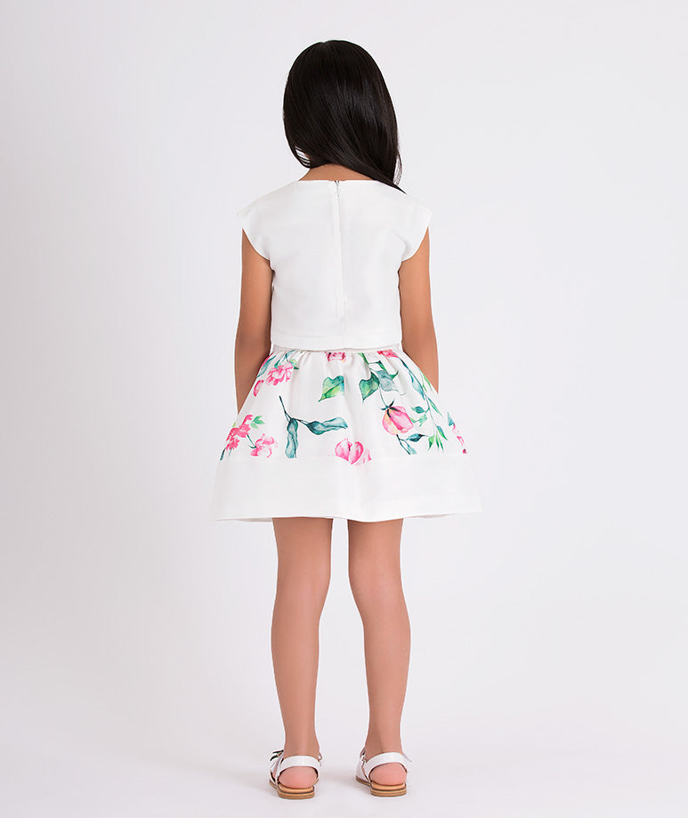 white blouse and floral skirt