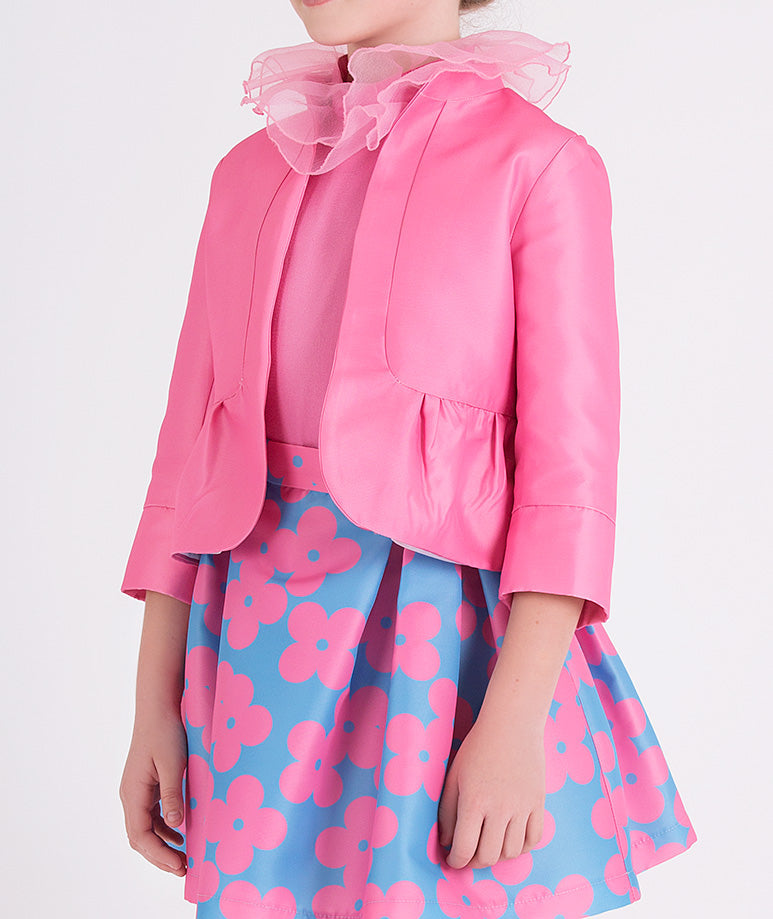 pink jacket, ruffled blouse and blue skirt with pink flower prints