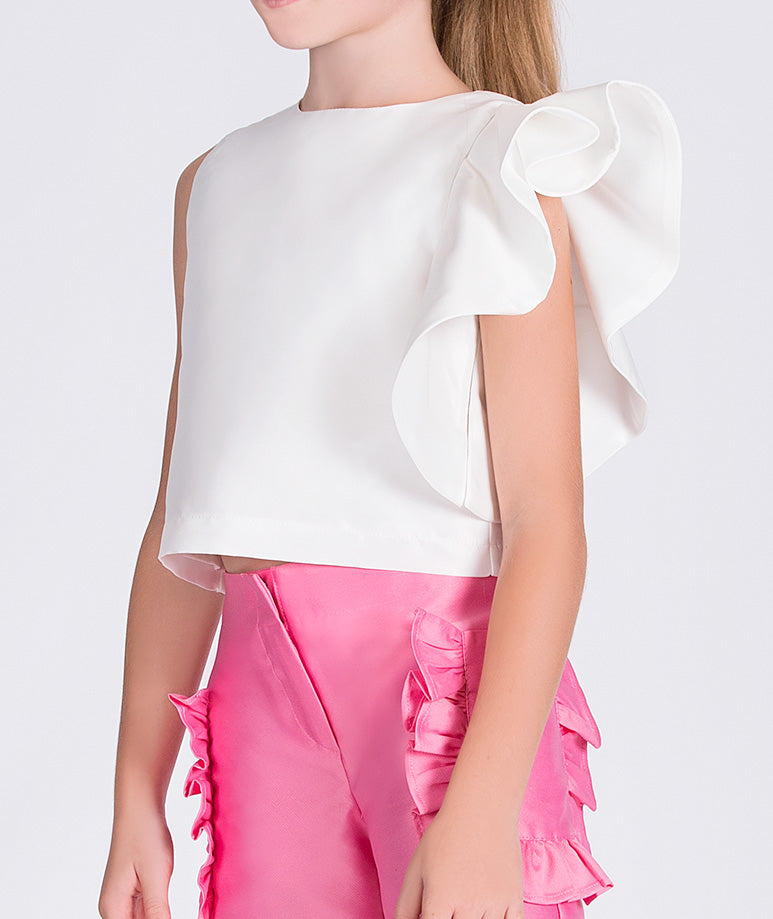 white ruffled sleeve blouse and pink pants with ruffled pockets
