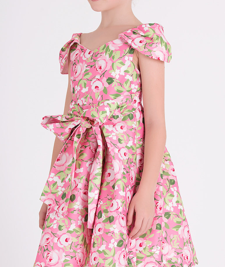 pink floral dress with a bow on the waist