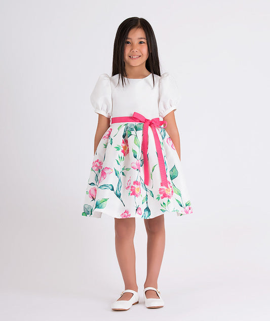 white balloon sleeved floral dress with a pink bow belt