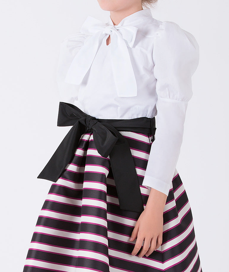 a formal white blouse with puff sleeves