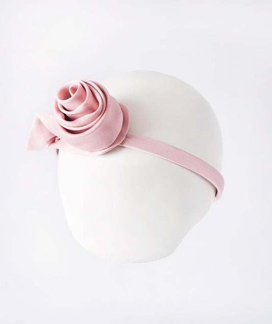 Salmon pink headband accented with a delicate 3D rose