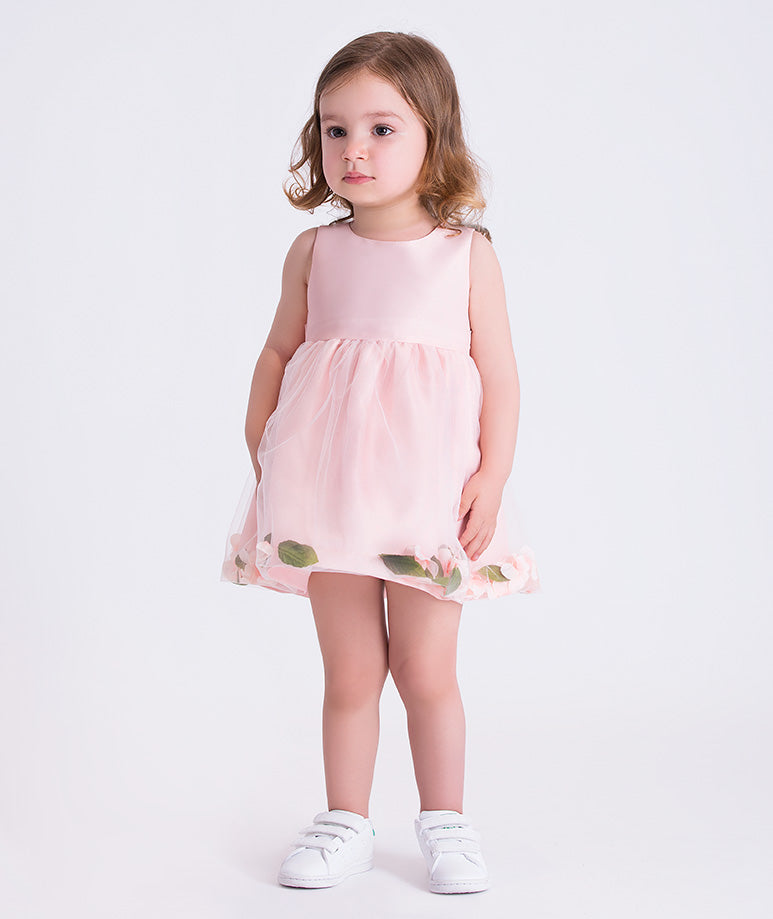 Front view of the 3D Petals Baby Girl Dress featuring a sleeveless blush design with tulle overlay and petal hem detailing, crafted from premium lightweight fabric with cotton lining, designed for babies ages 12–36 months for birthdays and special occasions.