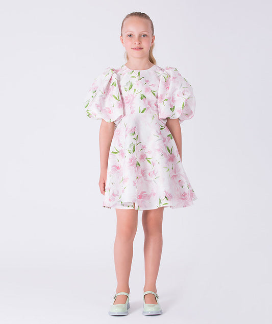Front view of a balloon sleeve floral girls dress by Mama Luma, designed for special occasions and celebrations. Elegant silhouette for girls ages 3–12.