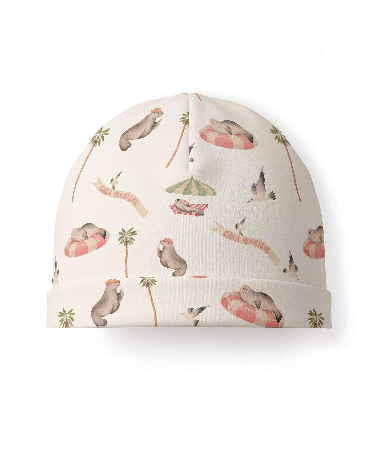 Beanie with seal and palm tree pattern on a white background