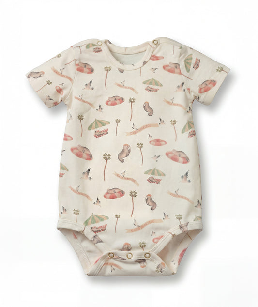 Baby onesie with nature-themed print on a white background