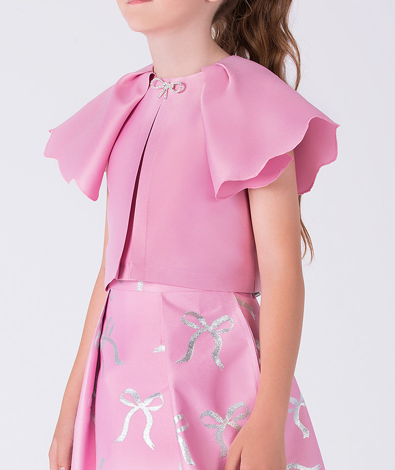 Pink dress with ruffled shoulders on a white background