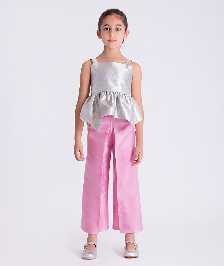4 years old girl wearing a white top and pink pants on a white background