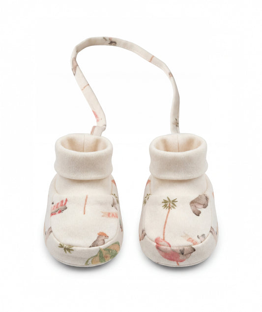 Pair of baby booties with floral pattern on a white background