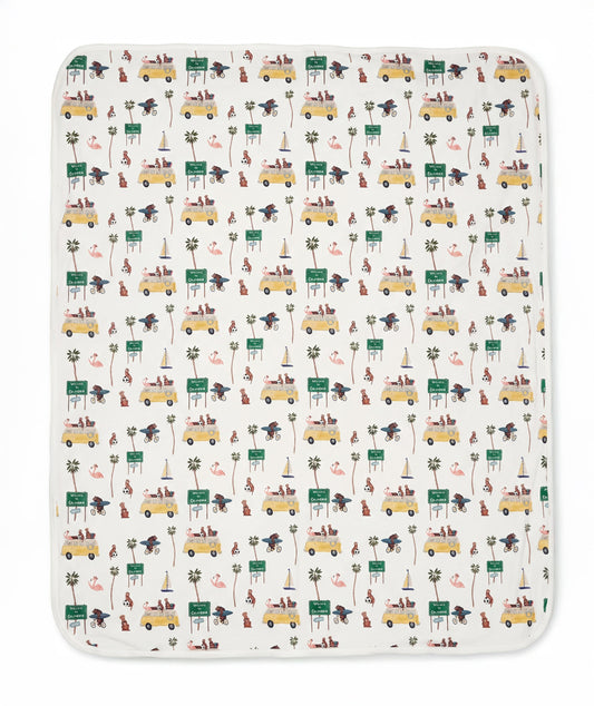 Patterned blanket with vehicles and nature elements on a white background