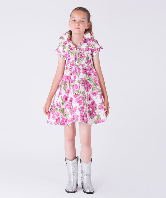 Luxury bougainvillea floral girls occasion dress worn by a 7-year-old girl, featuring crystal accents, sleeveless silhouette and softly flared skirt for weddings and special occasions.