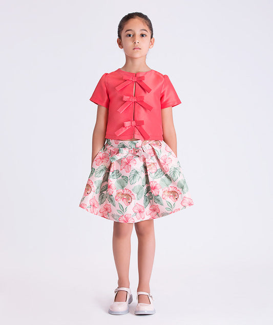 Front view of the Bow Enchanted Girls Outfit featuring a bow-detail short-sleeve top and floral skirt, crafted from premium lightweight fabric with cotton lining, designed for girls ages 3–12 for birthdays and special occasions.