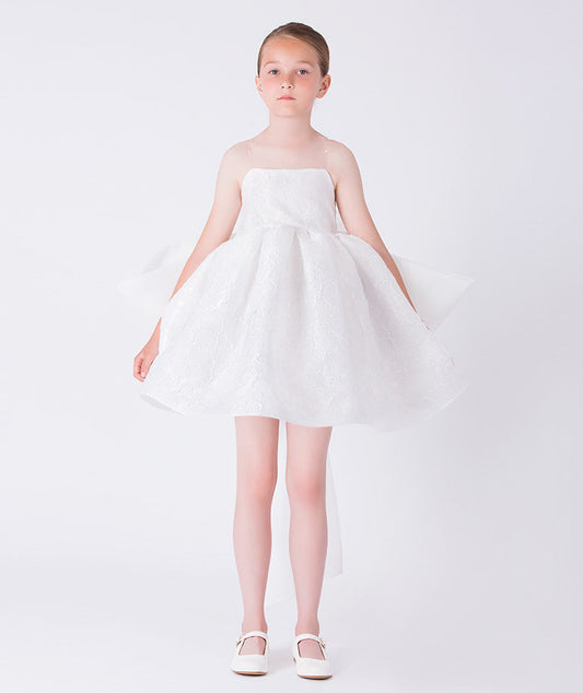 Exquisite jacquard girls occasion dress worn by a 7-year-old girl, featuring a voluminous skirt and refined silhouette for special events