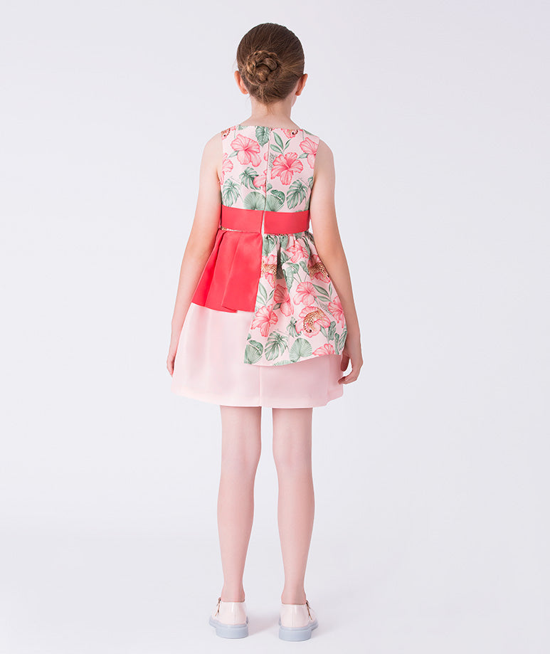 Back view of the Floral Bow Detail Girls Dress showing the sleeveless silhouette and softly layered skirt made from breathable lightweight fabric, designed for girls ages 3–12 for Eid, Easter, and elegant garden parties.