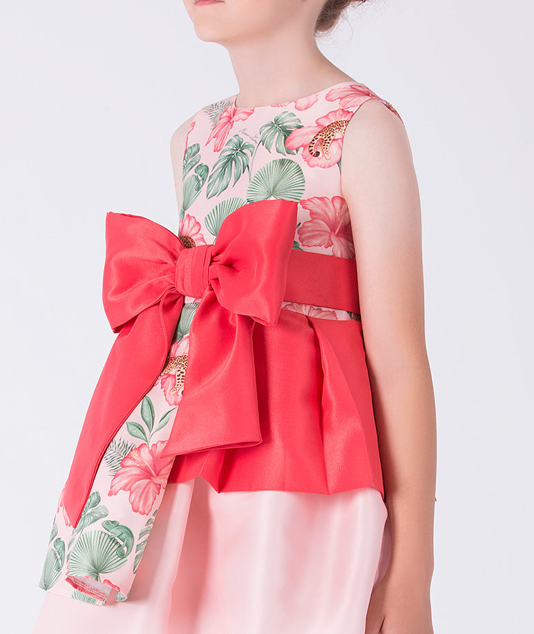 Close-up detail of the Floral Bow Detail Girls Dress highlighting the oversized bow accent and floral print on premium lightweight woven fabric, fully cotton lined for comfort, ideal for festive events and celebrations for ages 3–12.