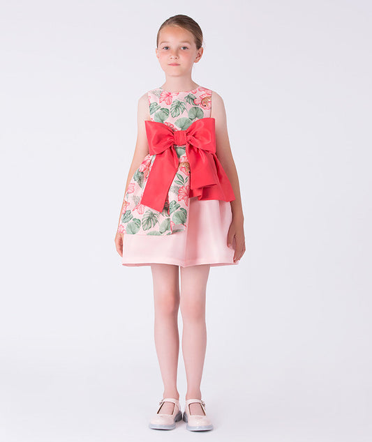 Front view of the Floral Bow Detail Girls Dress featuring a sleeveless floral bodice, oversized bow waist detail, and layered skirt, crafted from premium lightweight fabric with cotton lining, designed for girls ages 3–12 for birthdays and special occasions.