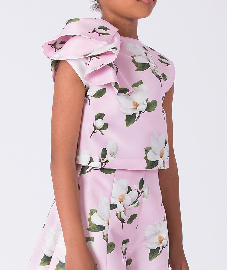 Girls pink two-piece floral outfit with ruffle detail top and flowing wide-leg pants by Mama Luma