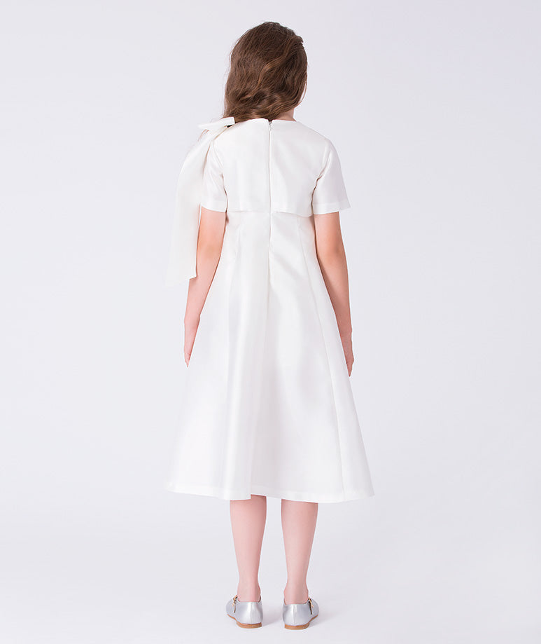 Back view of ivory A-line girls ceremony dress with concealed zipper and elegant structure.