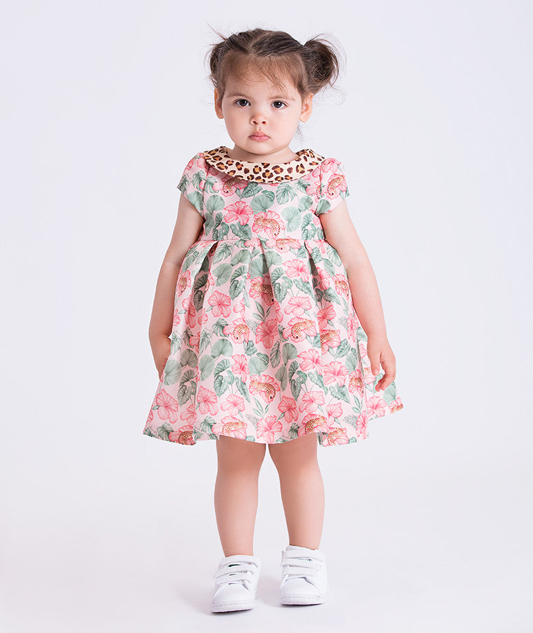 Front view of the Mahe Lotus Floral Baby Dress featuring a short-sleeve floral design with contrast animal-print collar, crafted from premium lightweight fabric with cotton lining, designed for babies ages 12–36 months for birthdays and special occasions.