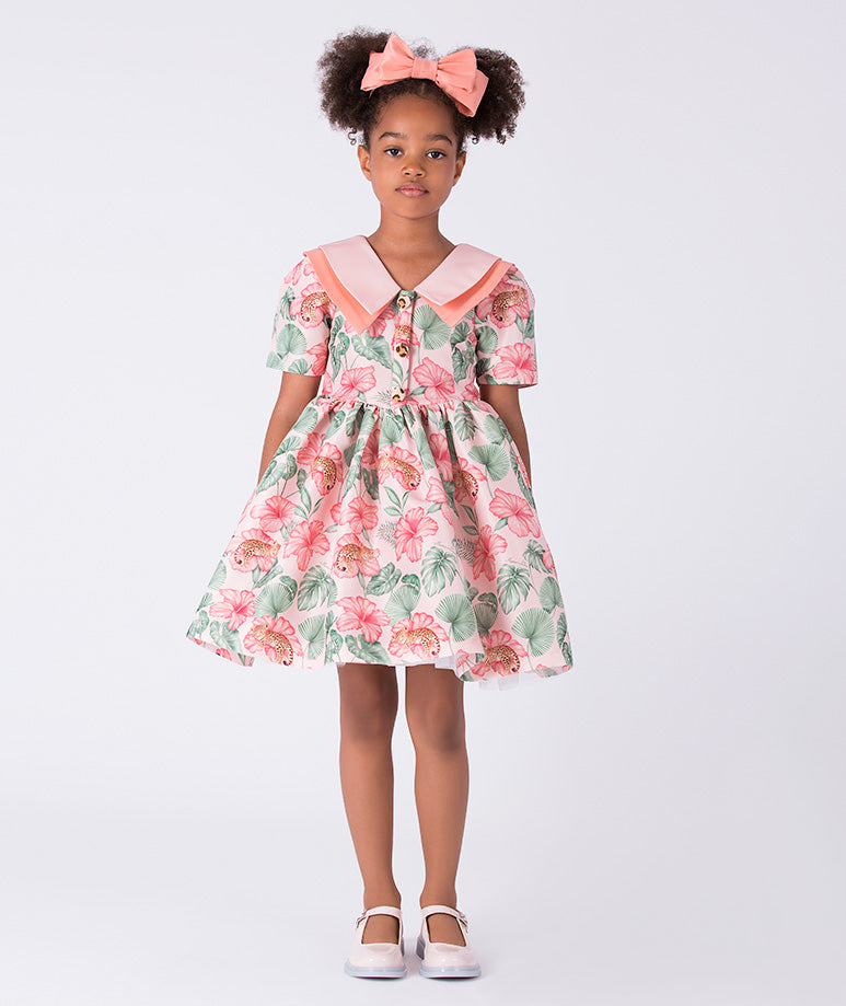 Front view of the Mahe Lotus Floral Girls Dress by Mama Luma, featuring a flared silhouette, Peter Pan collar, and lotus floral print on premium lightweight fabric, fully cotton lined for comfort, designed for girls ages 3–12 for birthdays, Easter, and special occasions.