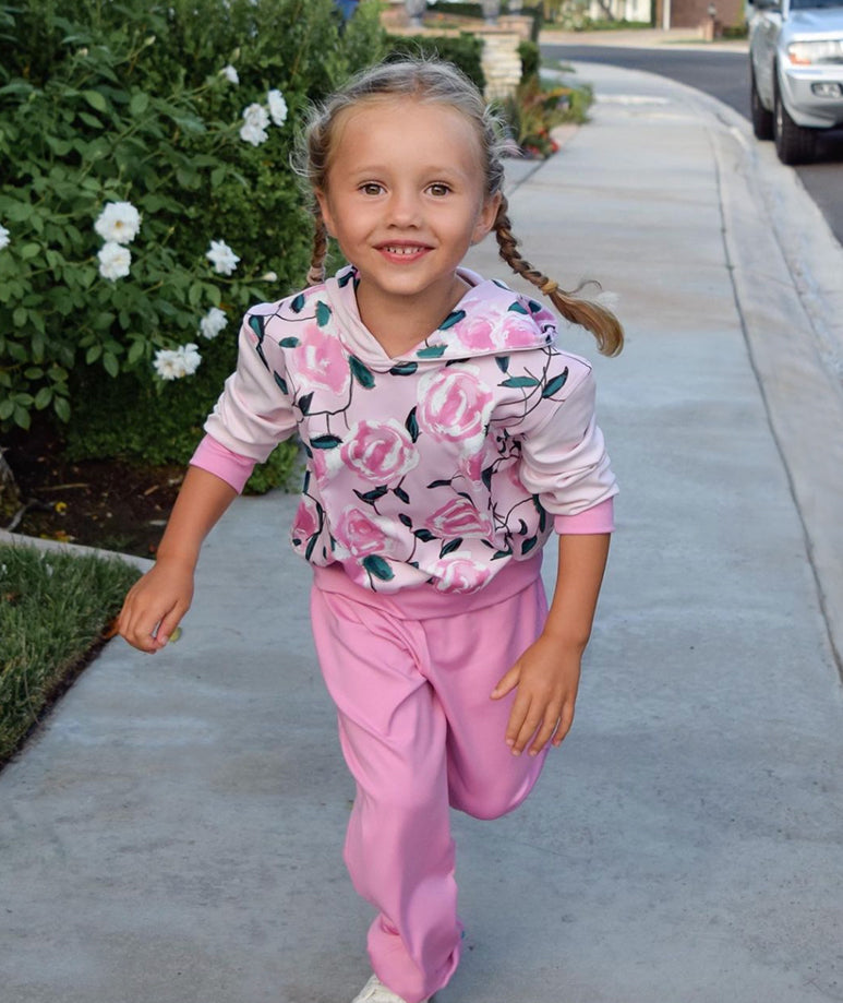 Girls' pink jogger outfit with floral top and sporty blue cuffed pants