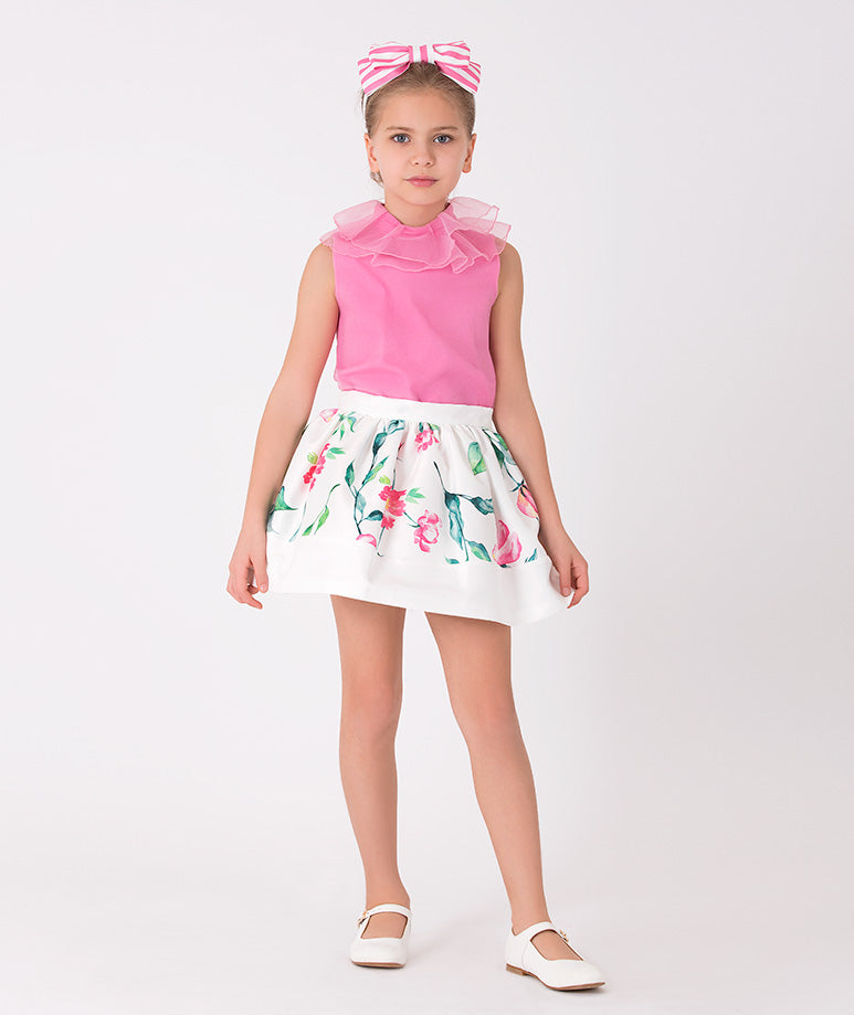 pink blouse and ecru floral skirt