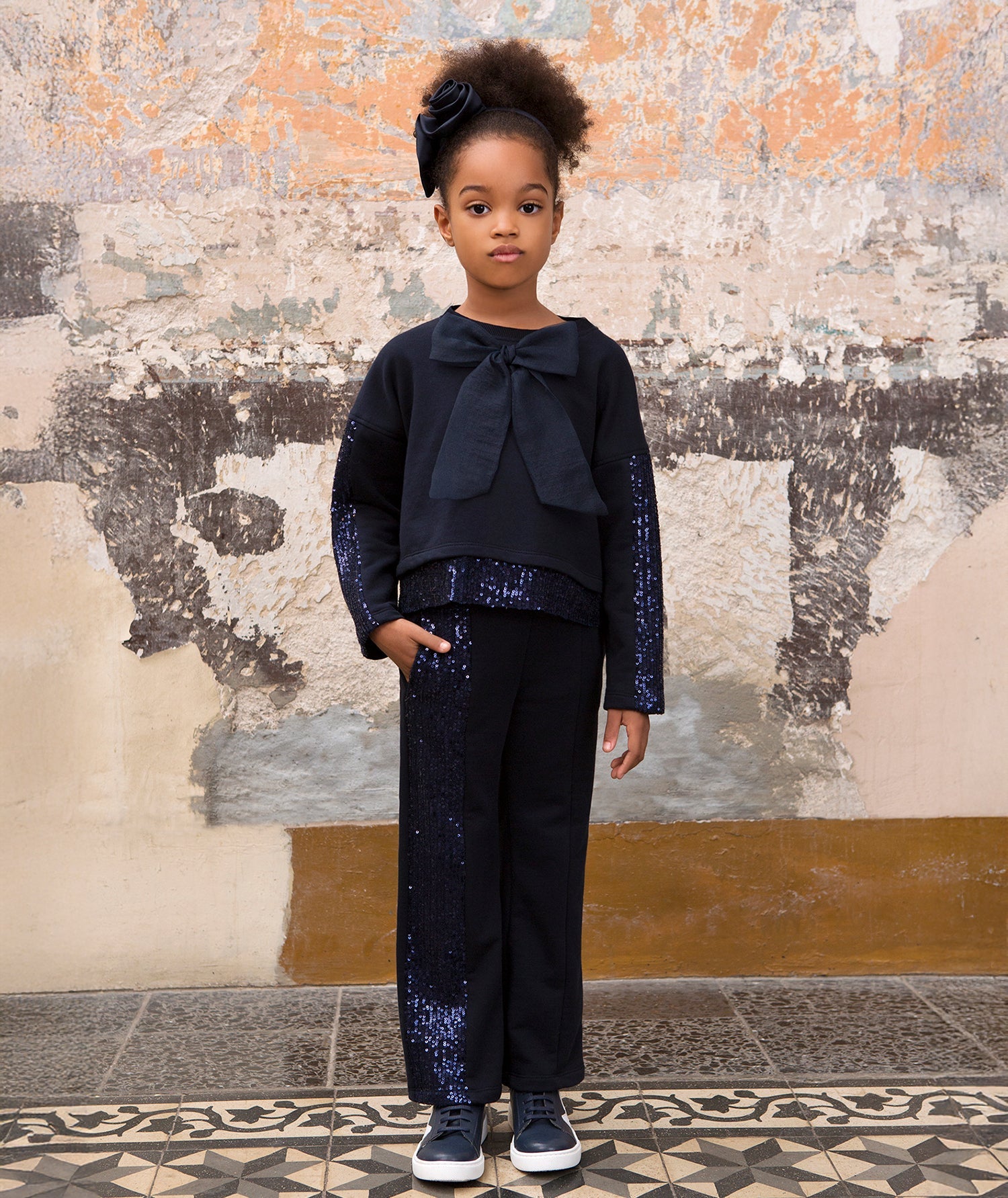 navy sparkling tracksuit with a bow on the front