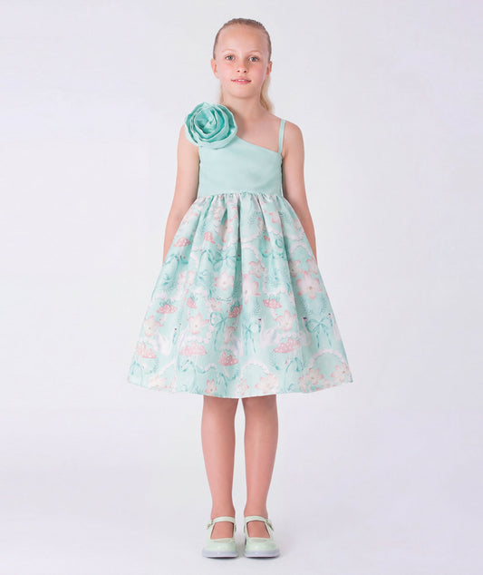 8 YEARS OLD girl in a floral dress standing in an elegant interior setting.