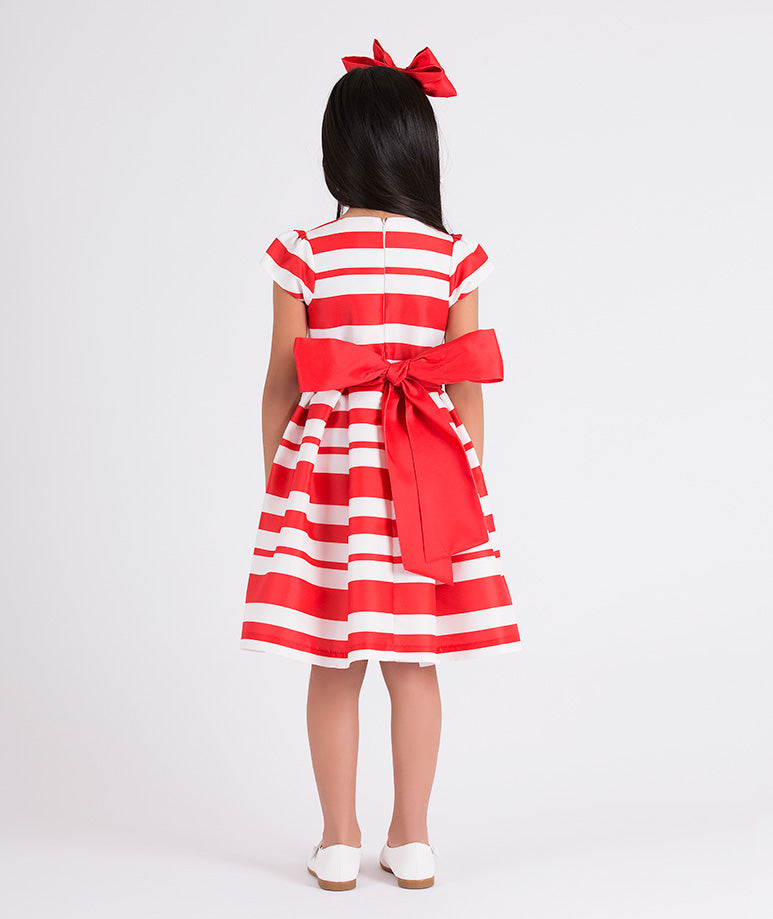 red and white striped dress with a big red bow on the back