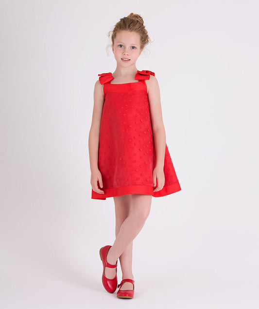 red summer dress with little polka dots and bows on the shoulders 