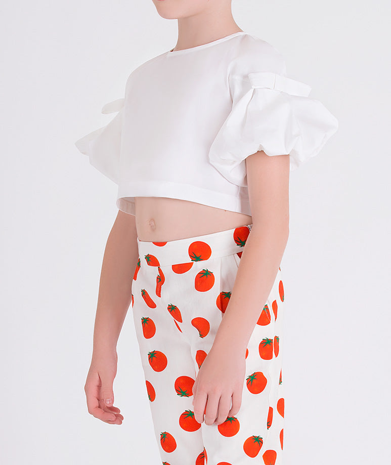 white blouse with balloon sleeves and matching pants with tomato prints