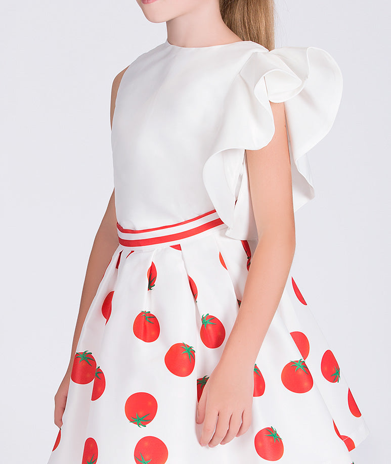 ecru blouse with one ruffled sleeve and matching skirt with tomato prints
