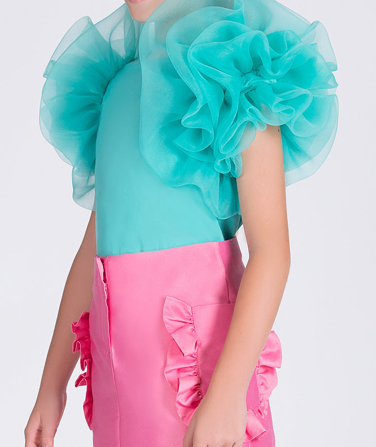 mint blouse with ruffled sleeves and pink skirt with ruffled pockets