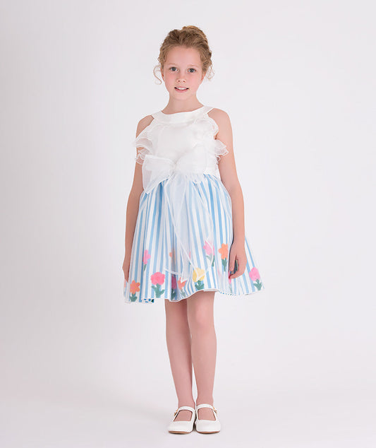 white organza dress with blue and white striped skirt with colorful flower prints