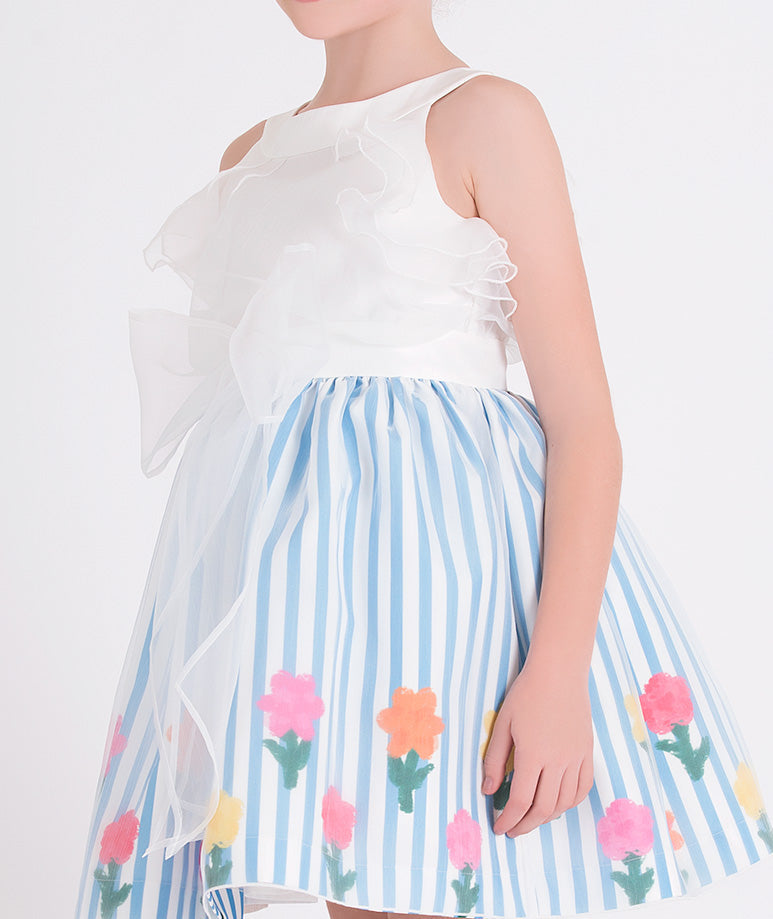 white organza dress with blue and white striped skirt with colorful flower prints