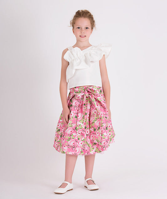 white ruffled one shoulder blouse and pink floral skirt