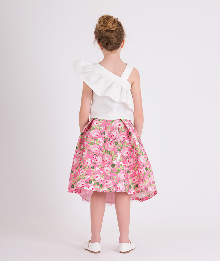 white one shoulder blouse with pink floral skirt