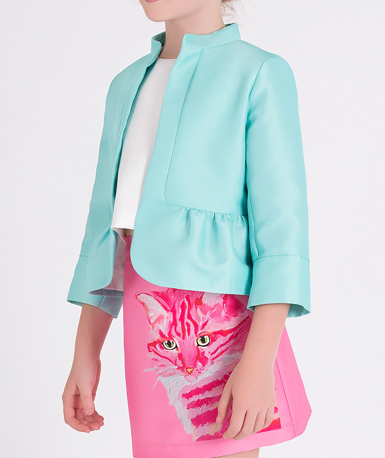 mint jacket and pink skirt with cat print